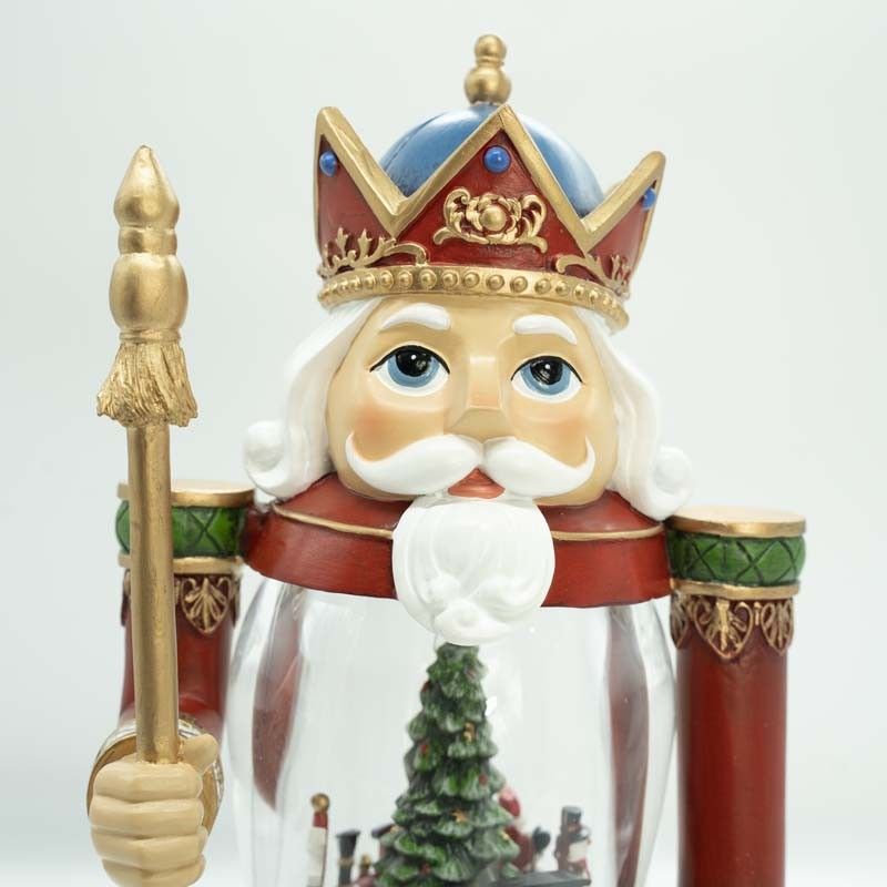 Schiaccianoci Natalizio in Resina e Acrilico con Albero e Treno in Movimento e Luci Led H.35 cm