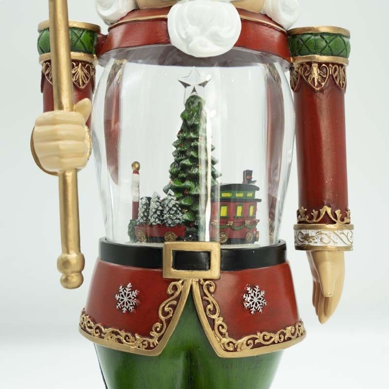 Schiaccianoci Natalizio in Resina e Acrilico con Albero e Treno in Movimento e Luci Led H.35 cm