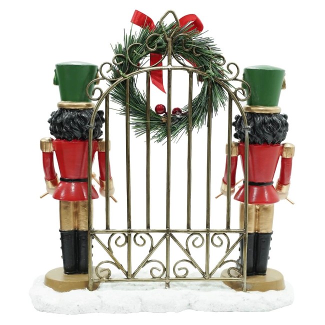 Schiaccianoci Natalizi in Resina con Cancello in Ferro H.22,5 cm