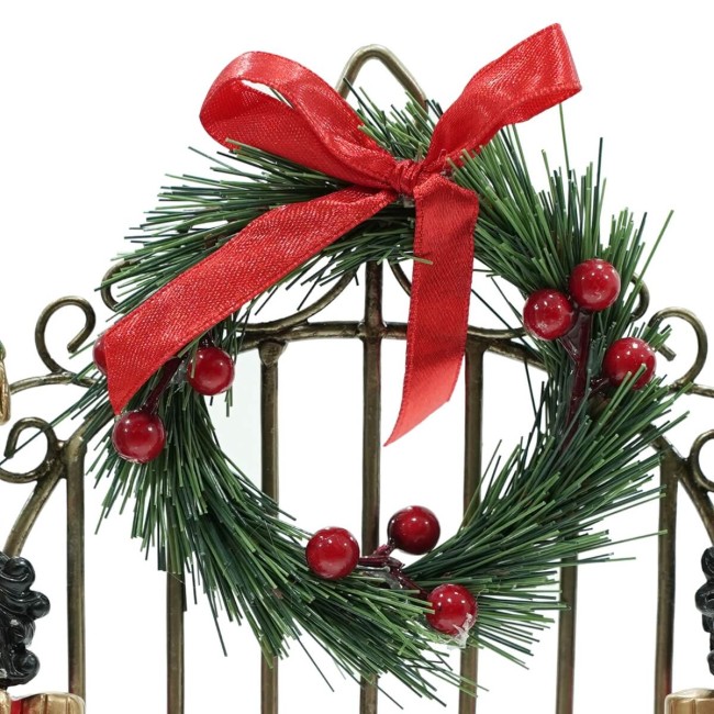 Schiaccianoci Natalizi in Resina con Cancello in Ferro H.22,5 cm